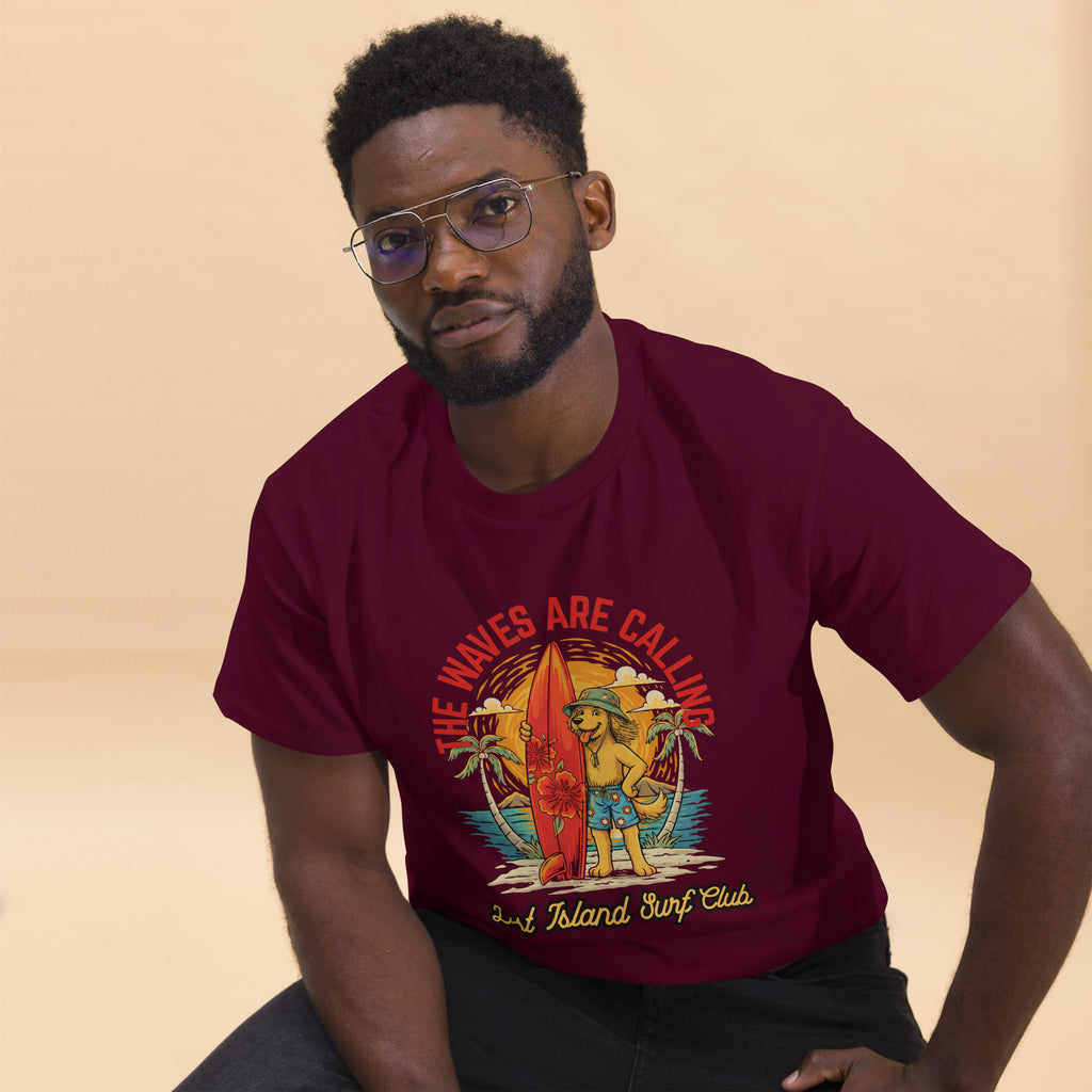 Model in maroon cotton T-shirt with island surfing graphic, standing with arms crossed, stylish streetwear outfit